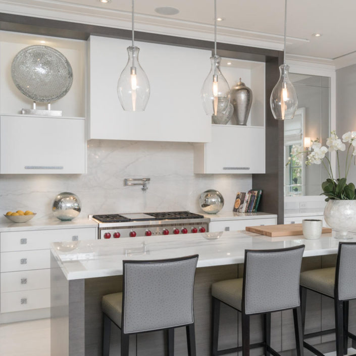 white cabinets in a modern kitchen with a large island