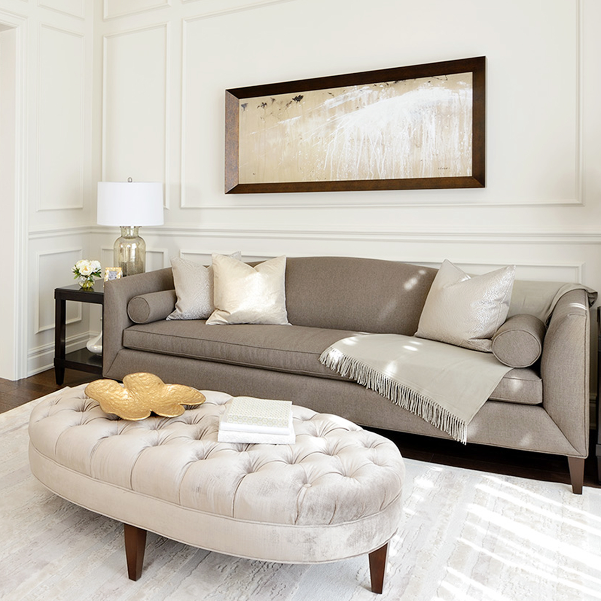 light brown couch and velvet tufted ottoman