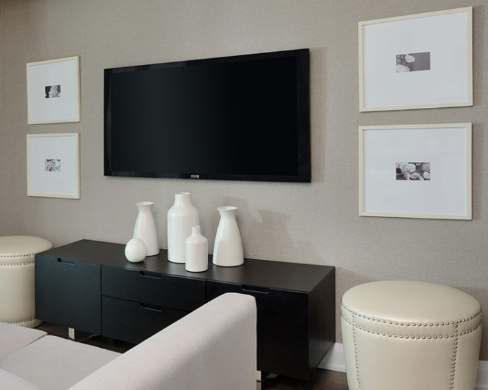 television mounted to a wall in a condo