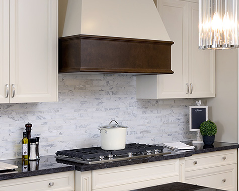 white kitchen cabinets with a pot on the stove